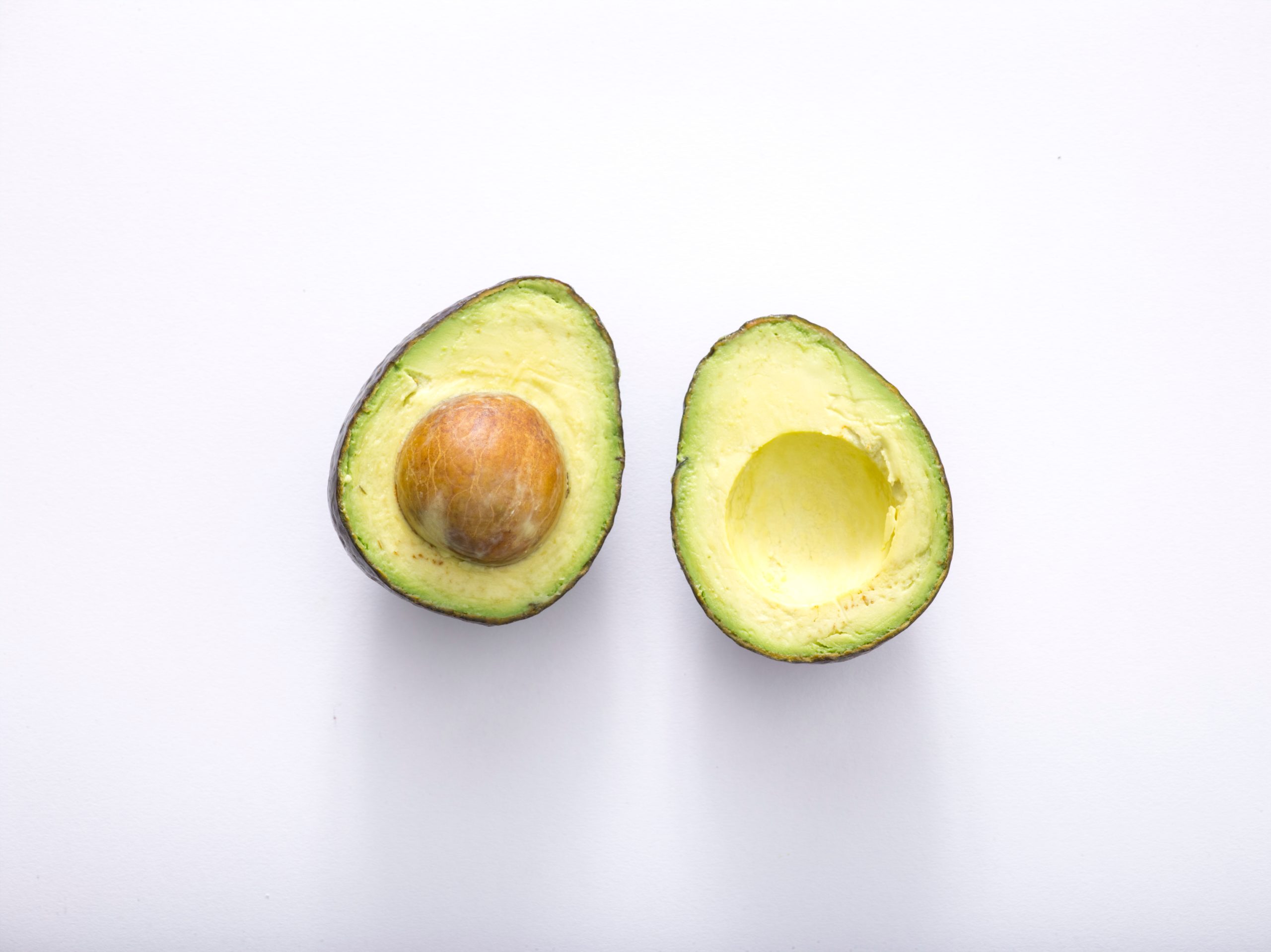 Nutrition as a key to wellness Avocado representing functional wellness coaching through personalized nutrition